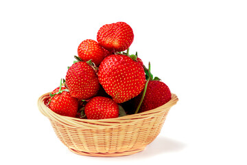 Close-up of sweet ripe strawberries in a basket isolated on a white background.