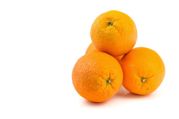 three oranges close-up on a white background, horizontal view