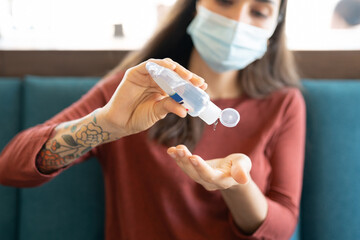 Woman Pouring Sanitizer On Hand