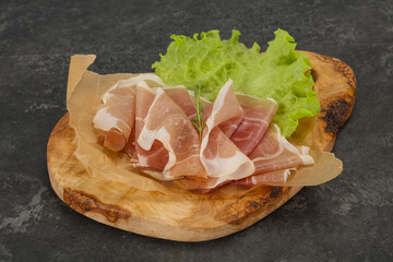 Italian prosciutto pork meat over board