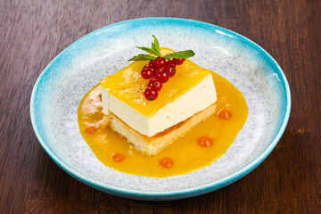 Traditional Cheesecake with orange sauce
