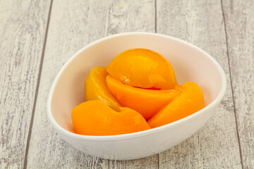 Marinated peaches fruit in the bowl