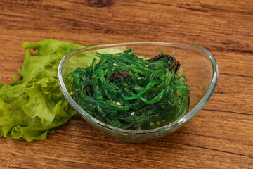 Green Chuka Seaweed Salad Isolated on White Background Top View. Wakame Sea Kelp Salat
