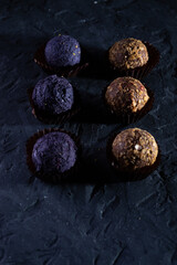 Colored round candies on a dark background