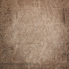 Tan brick wall texture background with vignette edges in a 12x12 design element for backdrops.
