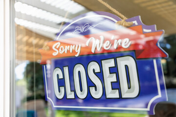 Storefront Closed Sign Through Window