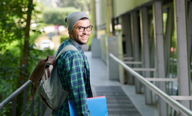 student with green shirt and headphones