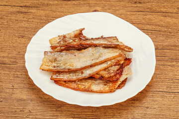 Roasted juicy bacon in the plate