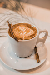 coffee latte art in a clean coffee shop with  White cup
