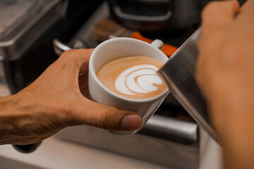 Fototapeta na wymiar barista putting tamper in coffee machine