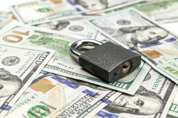 Money security. One hundred dollars of America with lock isolated on white. Usd cash money background.