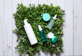 Organic cosmetics on a green spring grass background