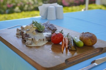 grilled meat served with vegetables 