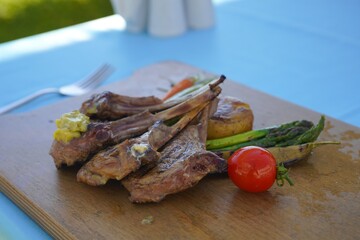 grilled steak served with vegetables
