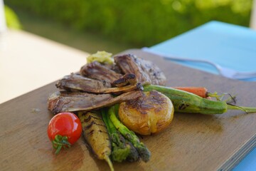grilled meat served with vegetables 
