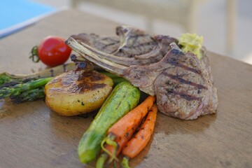 grilled meat served with vegetables 