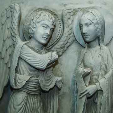 Antique statue of annunciation. Angel announces to Mary that she will conceive and bear God's son.