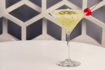 Fruit martini on white table with modern design bar background