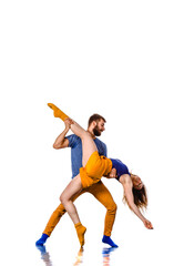 Two young breakdancers in a jumping pose