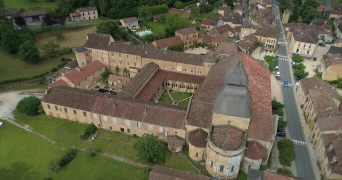 Cadouin village and abbey - aerial lateral travelling