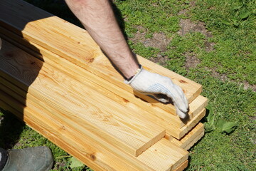 Wooden terrace board on a grass.