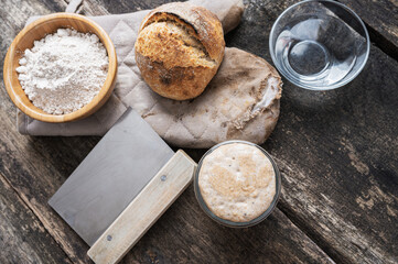 Still life setting of sourdough bread bun and ingredients