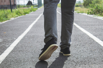 a person runs on a street treadmill