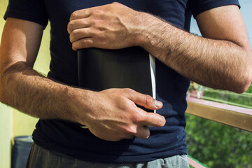 pray on the Bible in the balcony