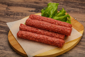 Raw beef sausages with spices