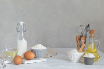 Ingredients for bakery butter flour, milk, oil, eggs, sugar, kitchen accessories