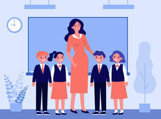Happy children and teacher standing together in classroom. Class, classmates, pupils flat vector illustration. Primary school, education concept for banner, website design or landing web page