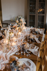 Beautiful stylish wedding with a beautiful decorated banquet table with fresh flowers. Wedding dinner. Served in a restaurant.