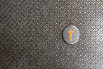 Yellow arrow, iron background