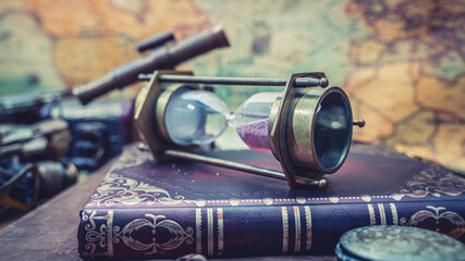 Hourglass On Old Book