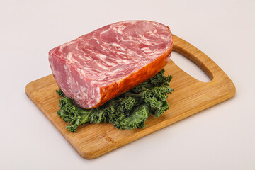 Beef ham piece over board