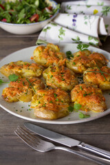 Smashed new baby potatoes with garlic and cheese. Healthy vegetarian food