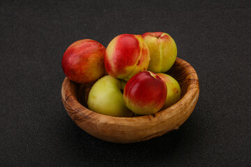 Sweet small nectarines in the basket