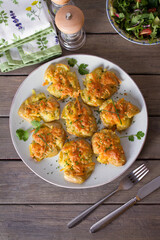 Smashed new baby potatoes with garlic and cheese. Healthy vegetarian food. View from above, top studio shot