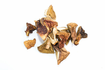 Dried porcini mushrooms on a white background.