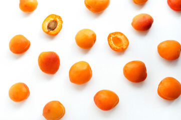 Pattern with ripe apricots on white background
