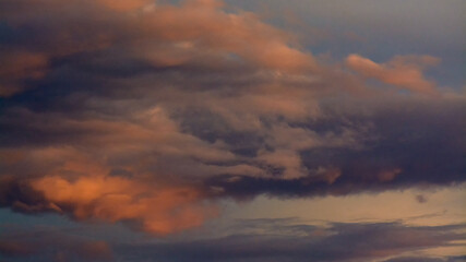 Naklejka na ściany i meble Dramatic sky at sunset after storm