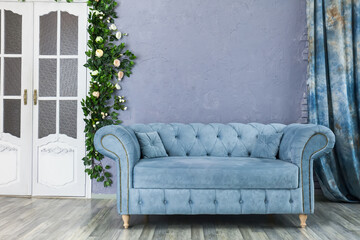 sofa chester on a background of gray wall - obrazy, fototapety, plakaty