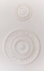 floral stucco moulding rosette on white ceiling