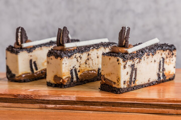 chocolate and oreo cake on wooden table