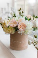 beautiful flowers in vases on old wooden windowsill