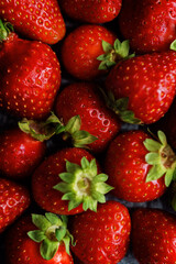 Raw fresh strawberries on a light background