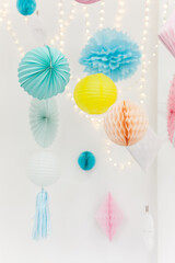 Party pom poms and paper lanterns. Cute party decorations.