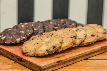 homemade chocolate and vanilla cookies on wood