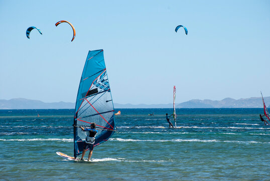 Athens, Greece, July 2020: Windsurfing and Kite Surfing on a very sunny day 