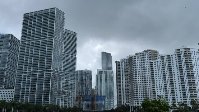 Miami cityscape on cloudy day. Tilt up